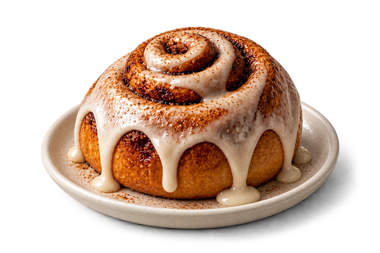 A glazed cinnamon roll on a ceramic plate