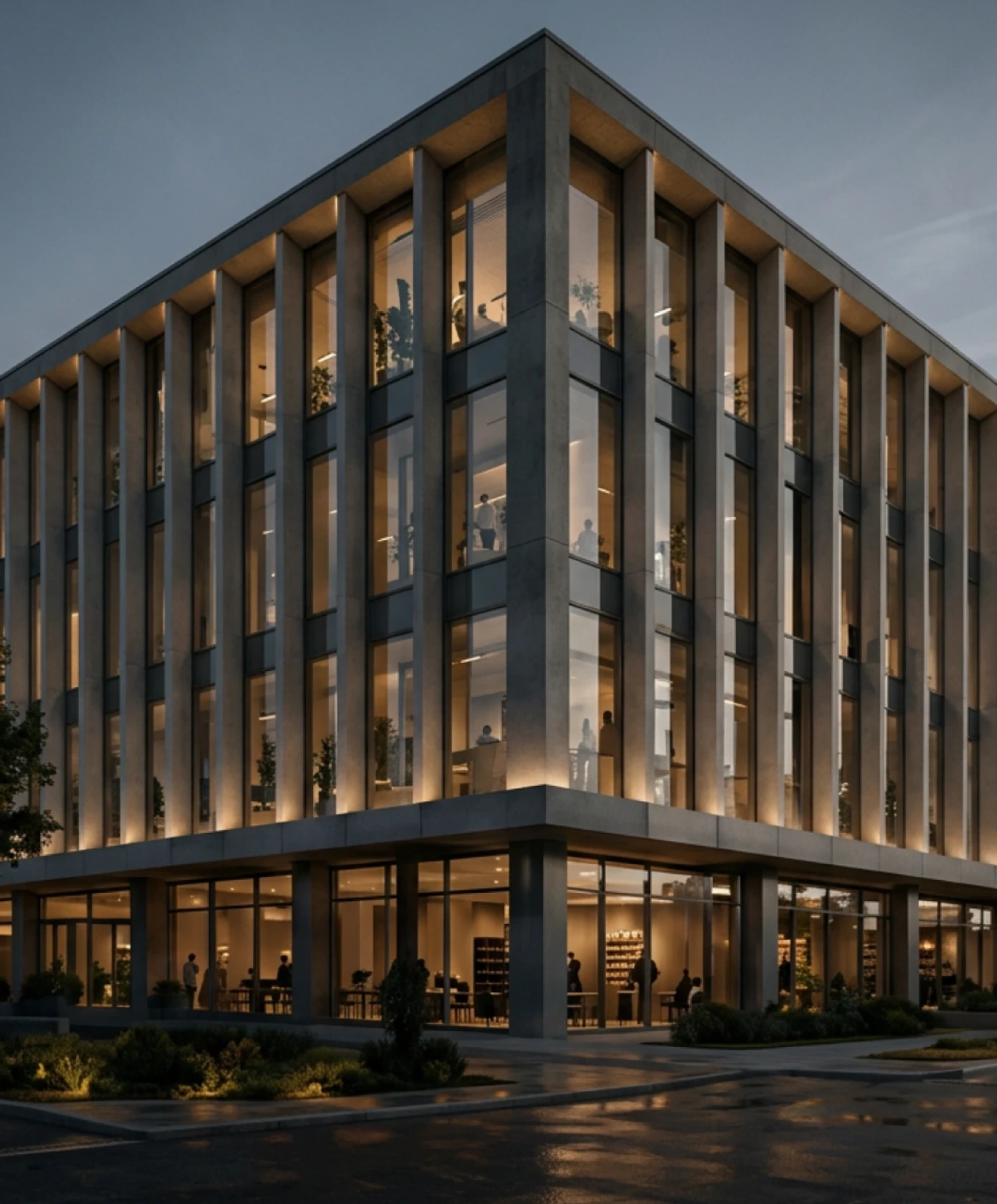 Colonnaded office building lit from within at evening