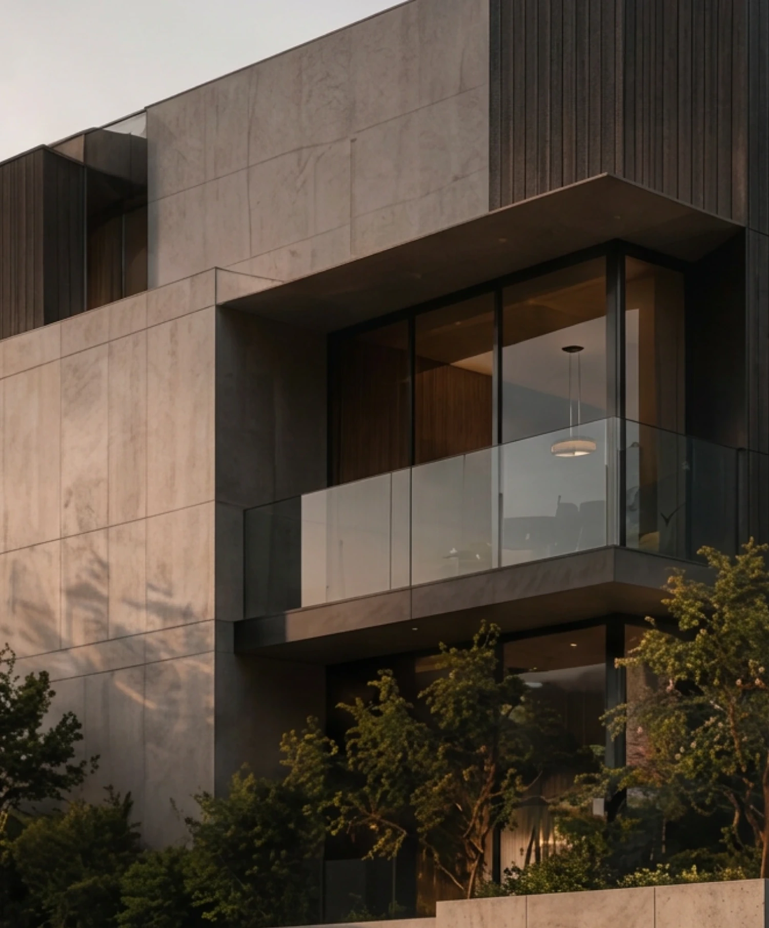 Stone-clad facade with a cantilevered balcony